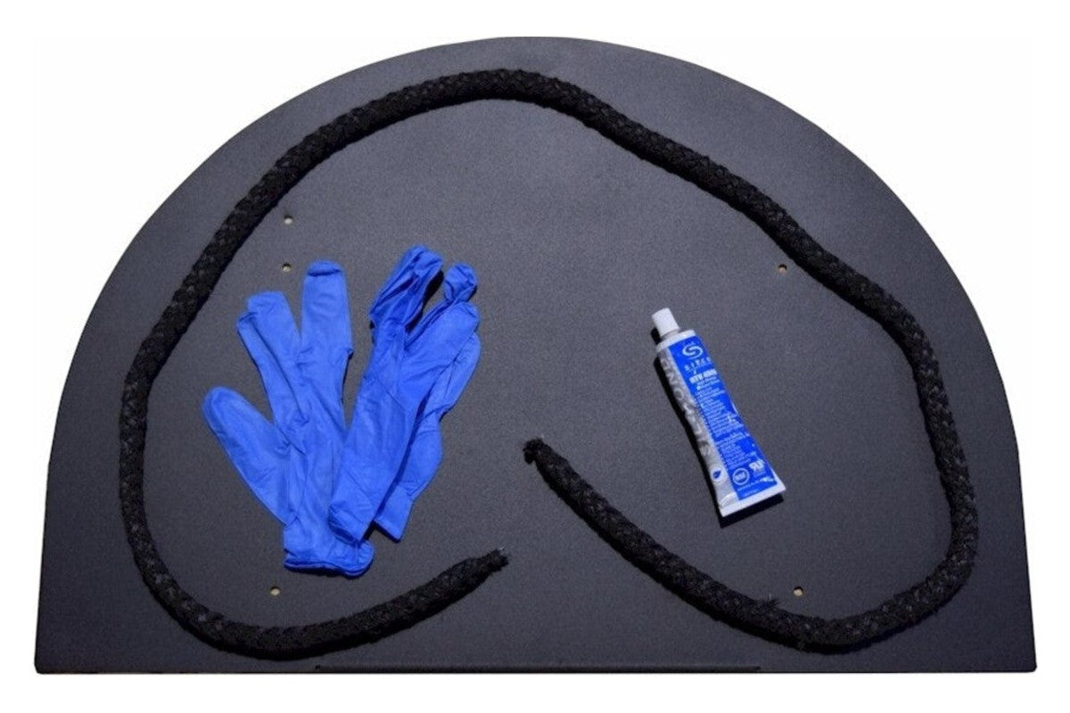 Rope gasket kit with rope, food-grade high-temp silicone and gloves on the back of a BrickWood oven door