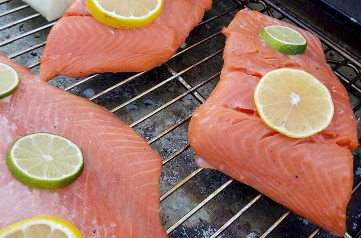 Smoking Salmon and Black Bass in a BrickWood Box using flavorful Alder cooking wood.